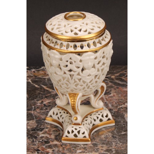 115 - A Graingers Worcester reticulated ovoid pedestal vase and cover, moulded with classical masks, three... 