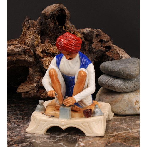 133 - A Royal Worcester figure, Karen Singh - Toolmaker, modelled by James Hadley, 11.5cm high, crown and ... 