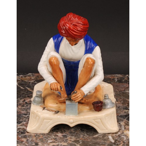 133 - A Royal Worcester figure, Karen Singh - Toolmaker, modelled by James Hadley, 11.5cm high, crown and ... 