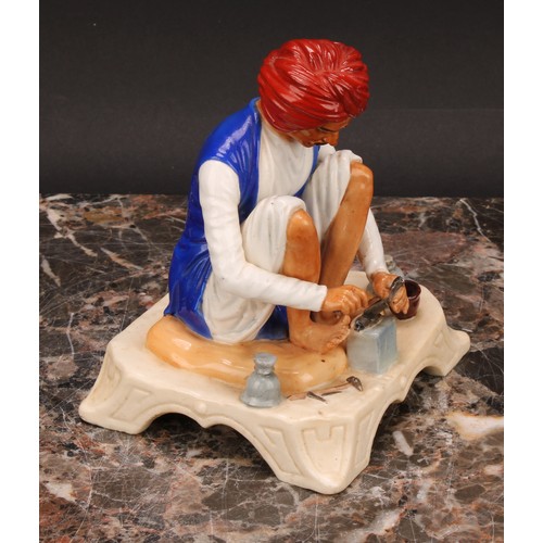 133 - A Royal Worcester figure, Karen Singh - Toolmaker, modelled by James Hadley, 11.5cm high, crown and ... 