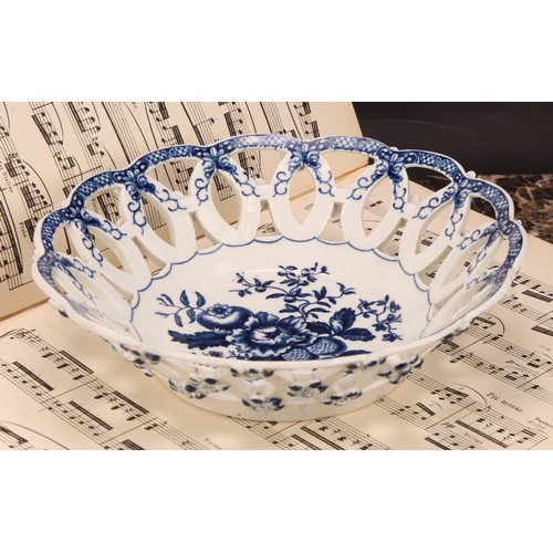 163 - A Worcester Pine Cone pattern shaped circular basket, printed in underglaze blue with peony between ... 