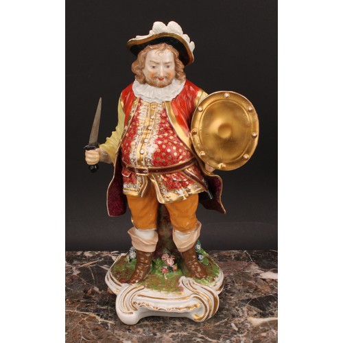 173 - A Derby figure, Quinn as Sir John Falstaff, he stands holding an oval shield and sword, wearing a br... 