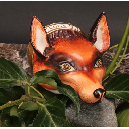 191 - An English porcelain novelty stirrup cup, possibly Derby, modelled as a fox mask, naturalistically p... 