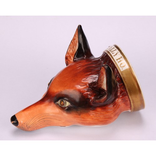 191 - An English porcelain novelty stirrup cup, possibly Derby, modelled as a fox mask, naturalistically p... 