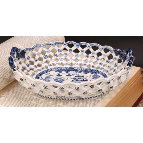 190 - An early Derby two-handled oval basket, central oval reserve painted in underglaze blue with a chino... 