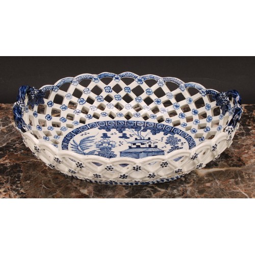 190 - An early Derby two-handled oval basket, central oval reserve painted in underglaze blue with a chino... 