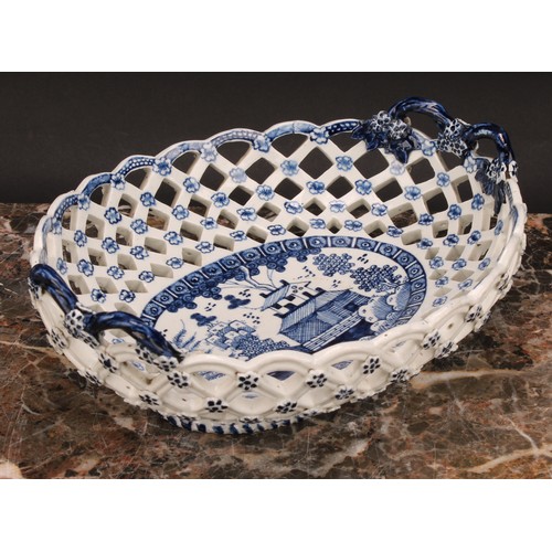 190 - An early Derby two-handled oval basket, central oval reserve painted in underglaze blue with a chino... 