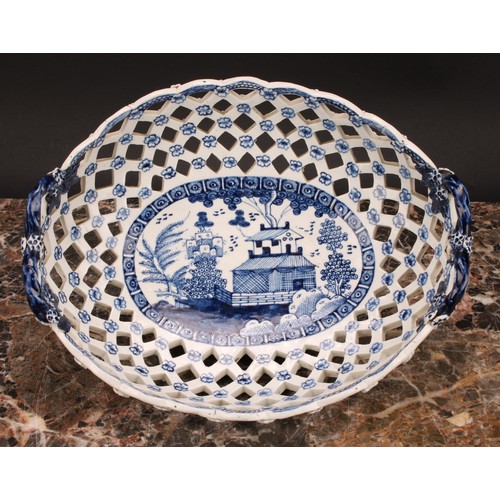 190 - An early Derby two-handled oval basket, central oval reserve painted in underglaze blue with a chino... 