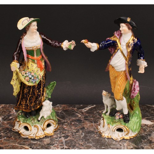 182 - A pair of Derby figures, Shepherd and Shepherdess, he wearing a broad brimmed black hat, blue jacket... 