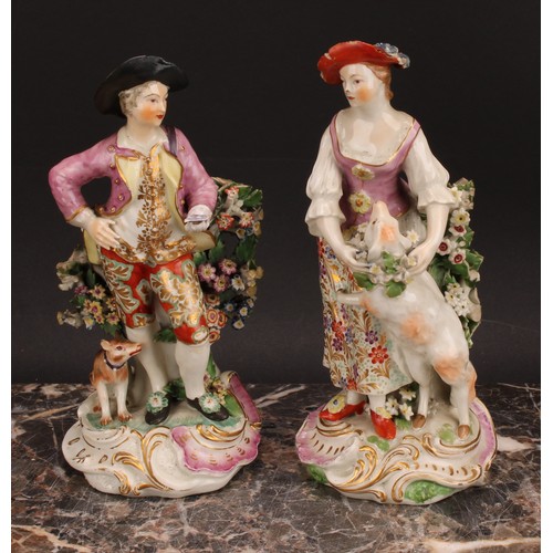 183 - A pair of Derby figures, The Garland Shepherds, he wearing a broad brimmed black hat, pink jacket, o... 