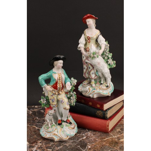 184 - A pair of Derby figures, The Garland Shepherds, he wearing a broad brimmed black hat, turquoise jack... 