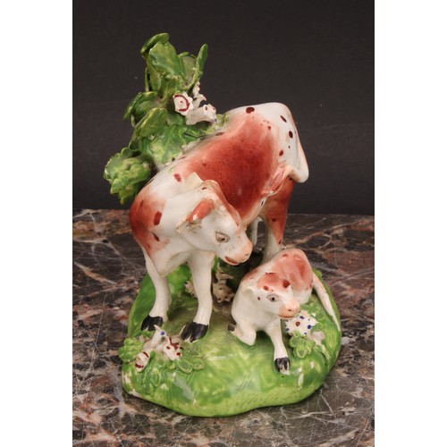 174 - A Derby model, of a cow and her calf, beside a tree, 15cm high, c.1815; others similar (3)