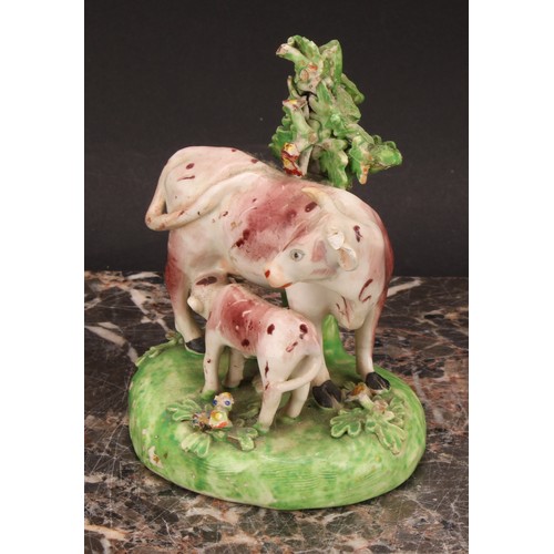 174 - A Derby model, of a cow and her calf, beside a tree, 15cm high, c.1815; others similar (3)