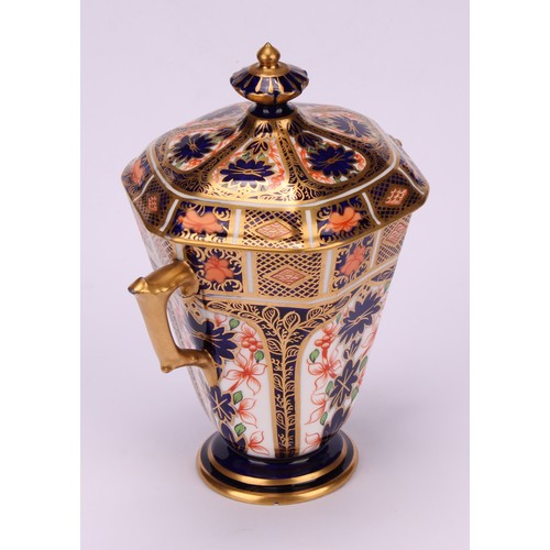 208 - A Royal Crown Derby 1128 Imari pattern hexagonal two-handled pedestal vase and cover, tapering sides... 