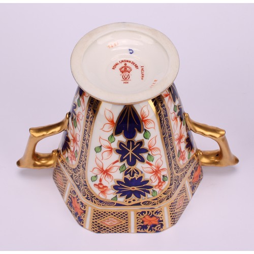 208 - A Royal Crown Derby 1128 Imari pattern hexagonal two-handled pedestal vase and cover, tapering sides... 