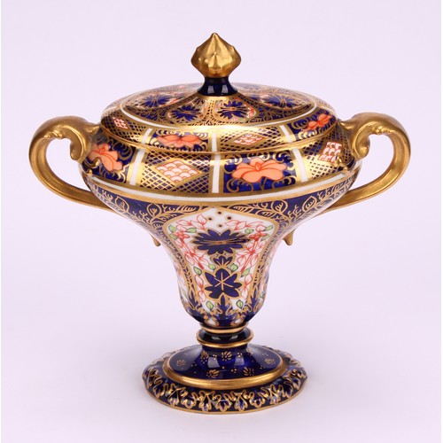 206 - A Royal Crown Derby 1128 Imari pattern flattened campana shaped two-handled vase and cover, oval sli... 