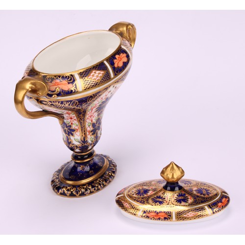 206 - A Royal Crown Derby 1128 Imari pattern flattened campana shaped two-handled vase and cover, oval sli... 