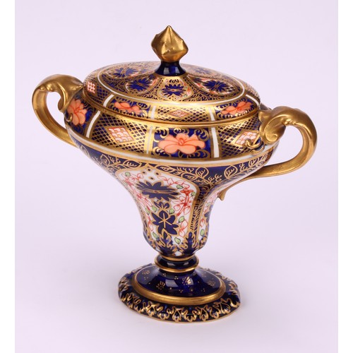 206 - A Royal Crown Derby 1128 Imari pattern flattened campana shaped two-handled vase and cover, oval sli... 