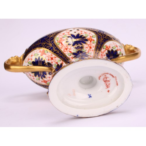 206 - A Royal Crown Derby 1128 Imari pattern flattened campana shaped two-handled vase and cover, oval sli... 