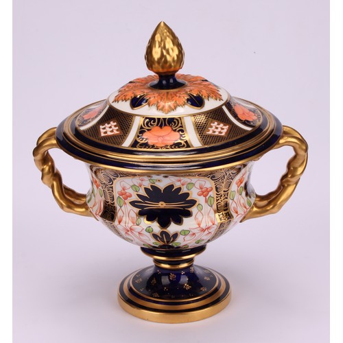 218 - A Royal Crown Derby 1128 Imari pattern two-handled campana shaped vase and cover, naturalistically m... 