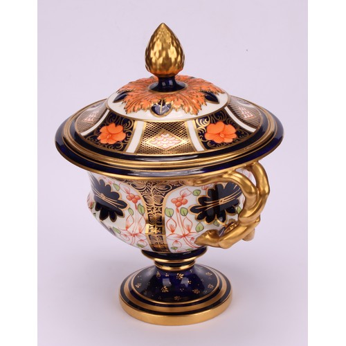 218 - A Royal Crown Derby 1128 Imari pattern two-handled campana shaped vase and cover, naturalistically m... 