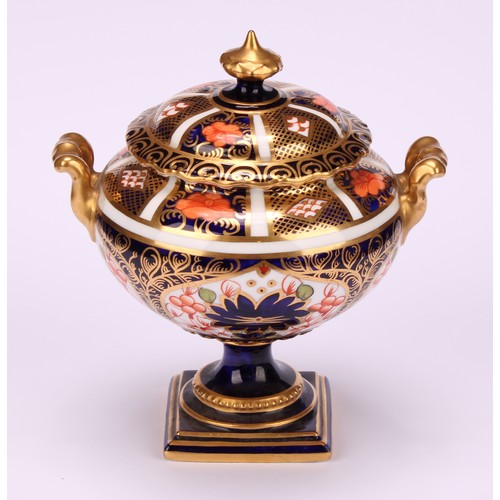 219 - A Royal Crown Derby 1128 Imari pattern two-handled campana shaped vase and cover, of compressed form... 