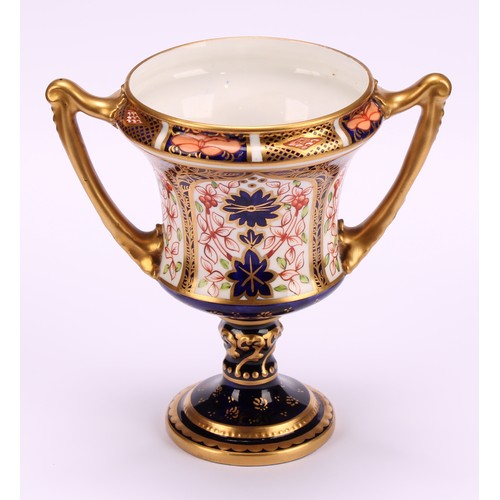 204 - A Royal Crown Derby 1128 Imari pattern campana shaped two-handled octagonal vase, of slender form, s... 