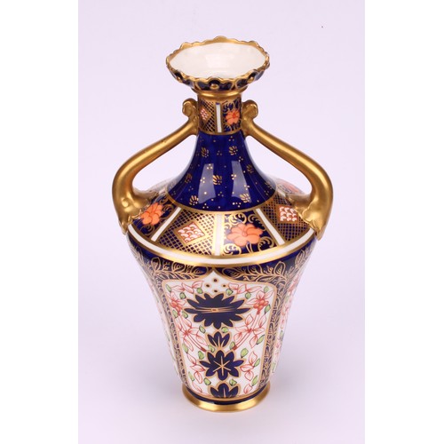 210 - A Royal Crown Derby 1128 Imari pattern ogee shaped two-handled vase, of slender form, foliate moulde... 