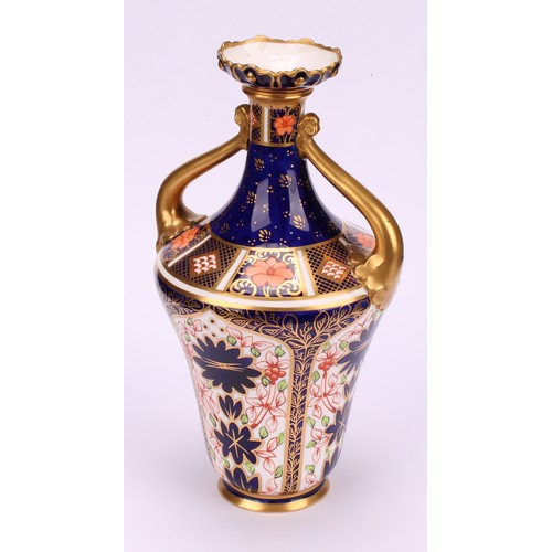 210 - A Royal Crown Derby 1128 Imari pattern ogee shaped two-handled vase, of slender form, foliate moulde... 