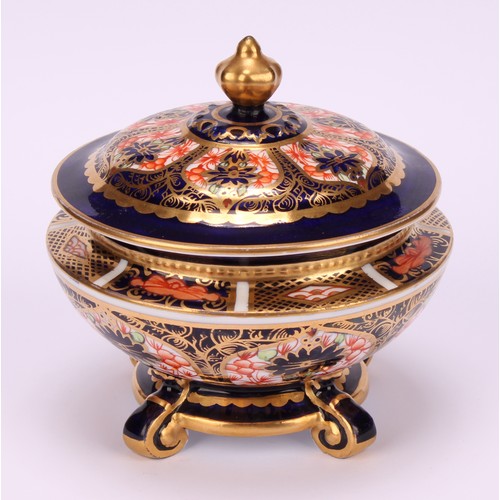 237 - An associated pair of Royal Crown Derby 1128 Imari pattern campana shaped boxes and covers, of compr... 