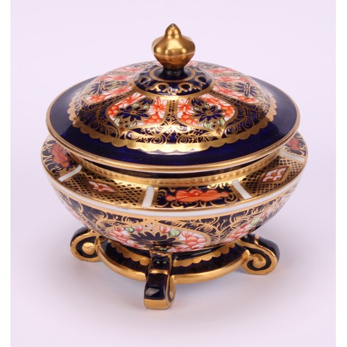 237 - An associated pair of Royal Crown Derby 1128 Imari pattern campana shaped boxes and covers, of compr... 