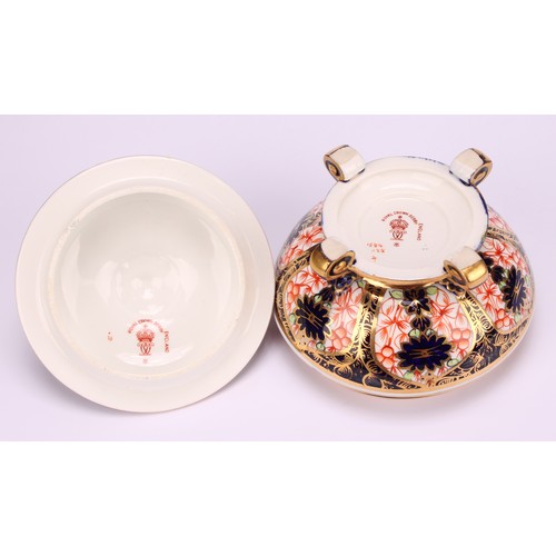 237 - An associated pair of Royal Crown Derby 1128 Imari pattern campana shaped boxes and covers, of compr... 