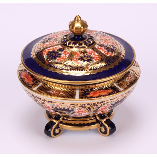 237 - An associated pair of Royal Crown Derby 1128 Imari pattern campana shaped boxes and covers, of compr... 