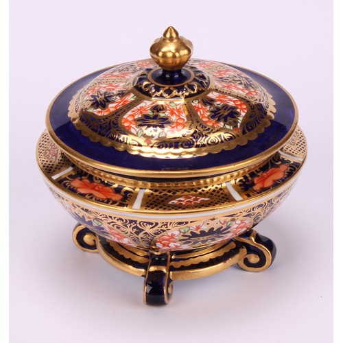 237 - An associated pair of Royal Crown Derby 1128 Imari pattern campana shaped boxes and covers, of compr... 