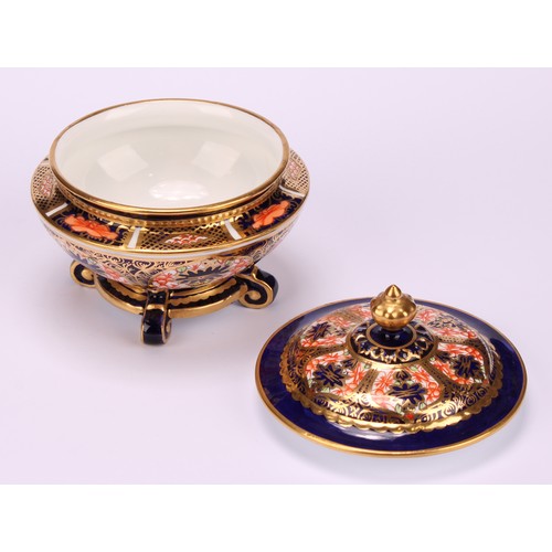 237 - An associated pair of Royal Crown Derby 1128 Imari pattern campana shaped boxes and covers, of compr... 