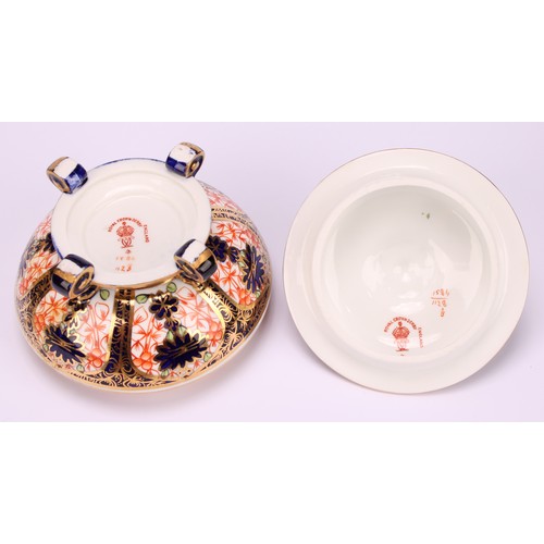 237 - An associated pair of Royal Crown Derby 1128 Imari pattern campana shaped boxes and covers, of compr... 