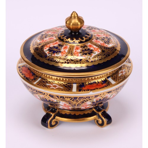 236 - An associated pair of Royal Crown Derby 1128 Imari pattern campana shaped boxes and covers, of compr... 