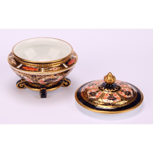 236 - An associated pair of Royal Crown Derby 1128 Imari pattern campana shaped boxes and covers, of compr... 