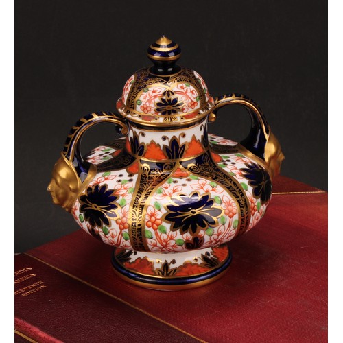 229 - A Royal Crown Derby Imari pattern compressed ovoid two-handled pedestal vase, domed cover, scroll ha... 