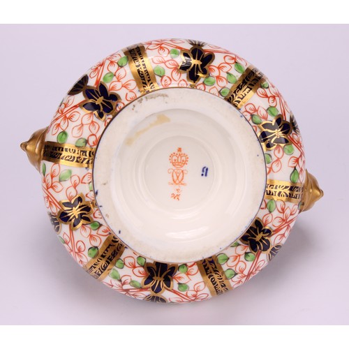 229 - A Royal Crown Derby Imari pattern compressed ovoid two-handled pedestal vase, domed cover, scroll ha... 