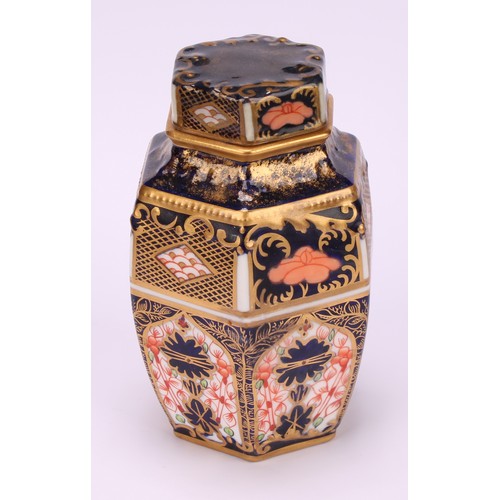 248 - An associated set of three Royal Crown Derby 1128 Imari pattern hexagonal caddies and covers, moulde... 