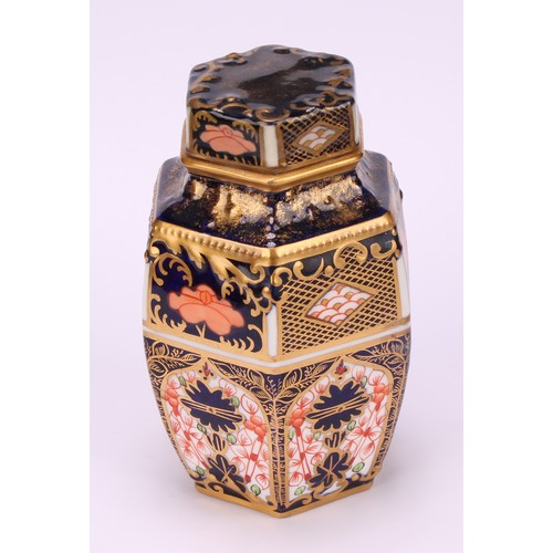 248 - An associated set of three Royal Crown Derby 1128 Imari pattern hexagonal caddies and covers, moulde... 