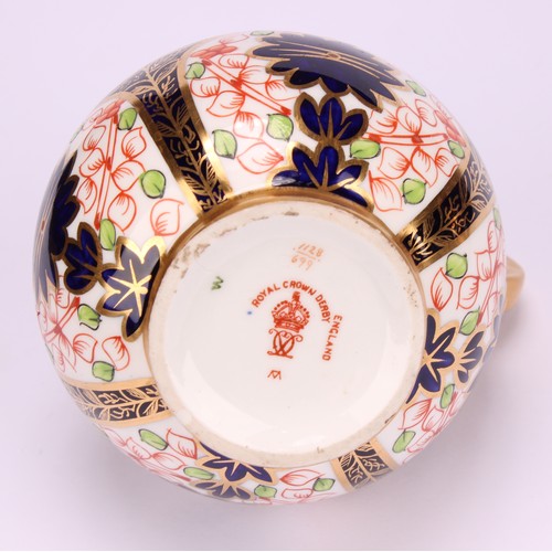 240 - An associated pair of Royal Crown Derby 1128 Imari pattern globular ewers, gilt scroll handles, 12cm... 