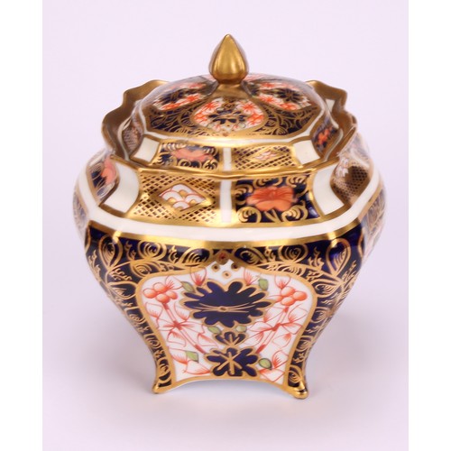 244 - An associated pair of Royal Crown Derby 1128 Imari pattern shaped square boxes and covers, of lobed ... 