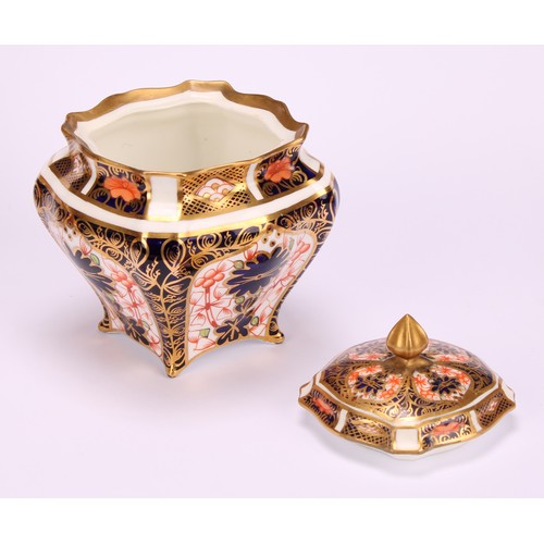 244 - An associated pair of Royal Crown Derby 1128 Imari pattern shaped square boxes and covers, of lobed ... 