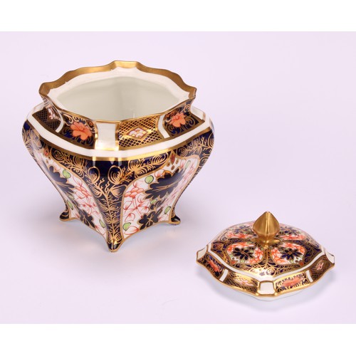 244 - An associated pair of Royal Crown Derby 1128 Imari pattern shaped square boxes and covers, of lobed ... 