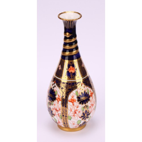 196 - A pair of Royal Crown Derby 1128 Imari pattern ovoid bottle vases, the slender necks moulded with sp... 