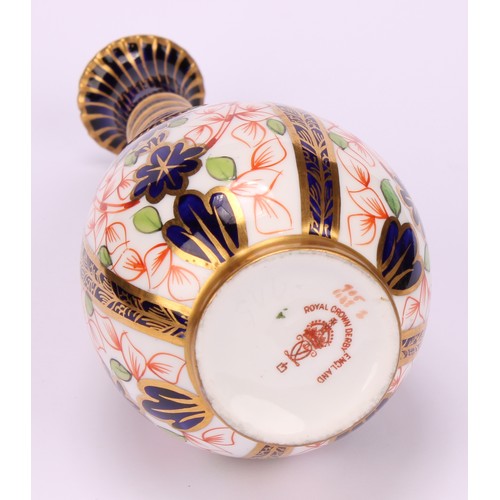 196 - A pair of Royal Crown Derby 1128 Imari pattern ovoid bottle vases, the slender necks moulded with sp... 