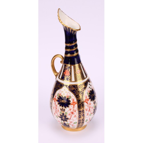 196 - A pair of Royal Crown Derby 1128 Imari pattern ovoid bottle vases, the slender necks moulded with sp... 