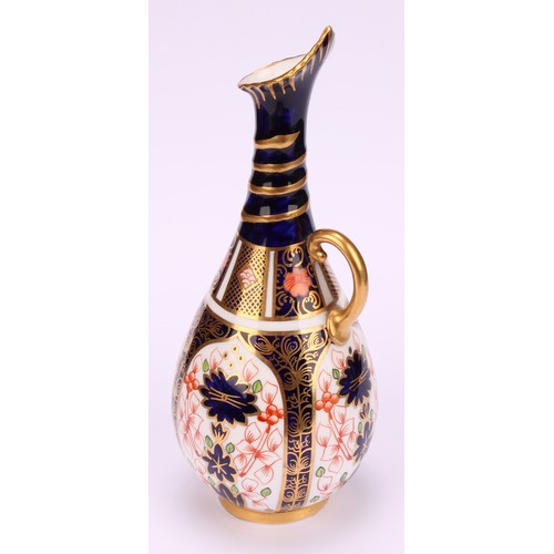 196 - A pair of Royal Crown Derby 1128 Imari pattern ovoid bottle vases, the slender necks moulded with sp... 